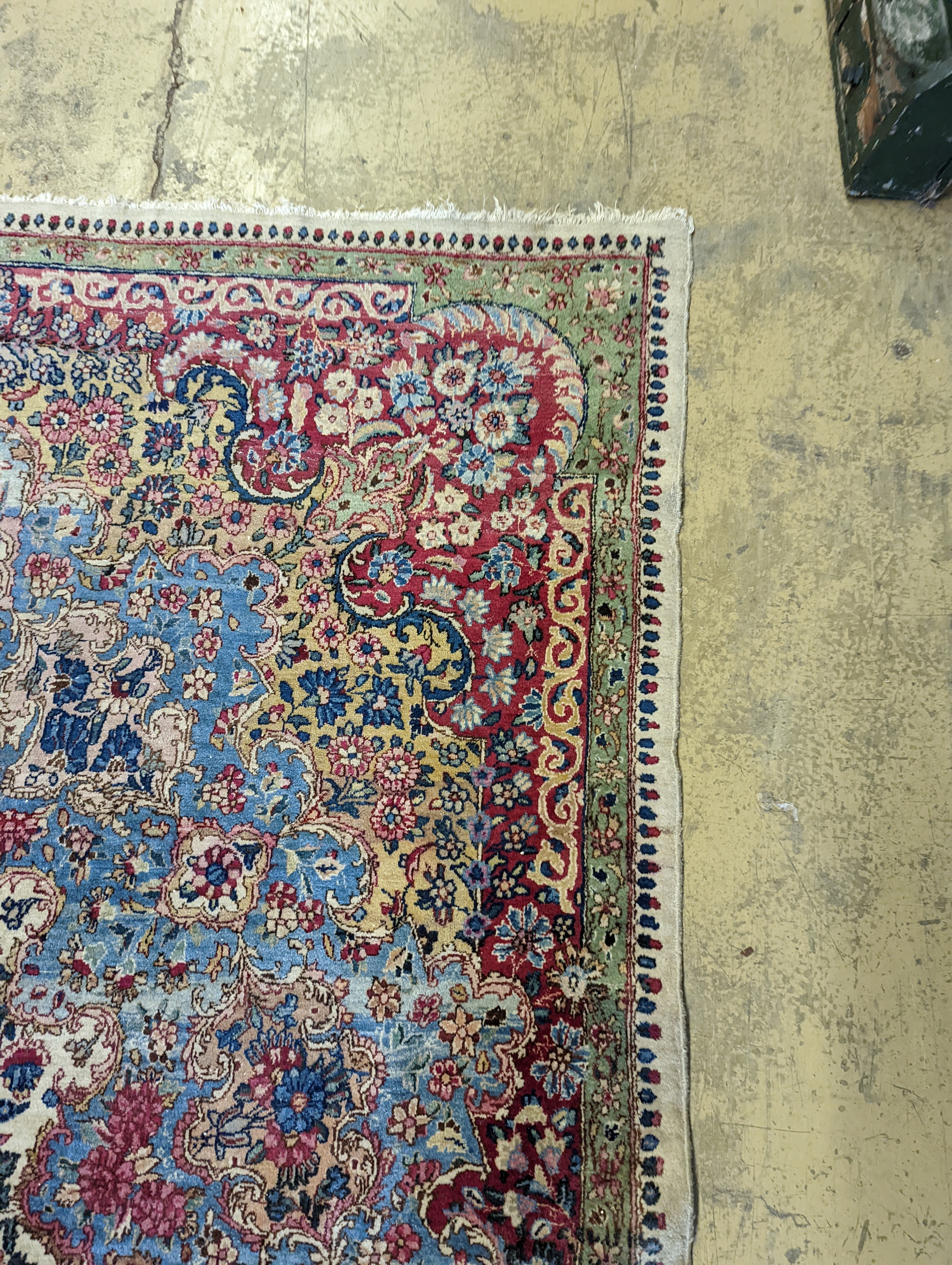 A North West Persian ivory ground carpet, 396 x 290cm